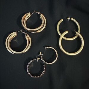 Fashion earrings, large hoops.